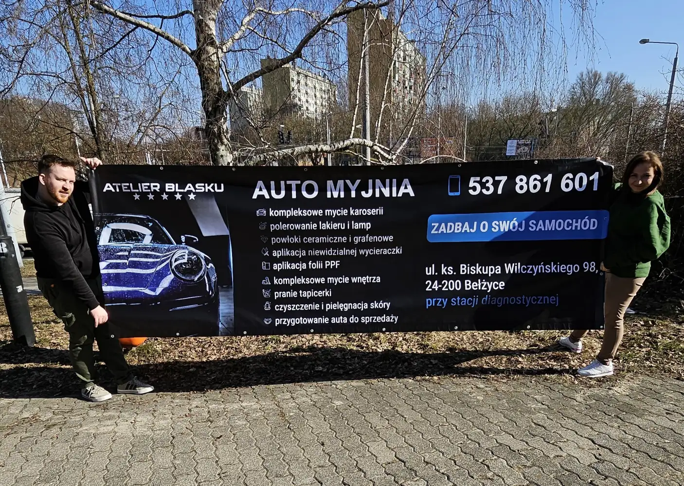 Banery reklamowe Lublin-baner reklamowy dla Atelier Blasku-baner reklamowy oczkowany w Lublinie